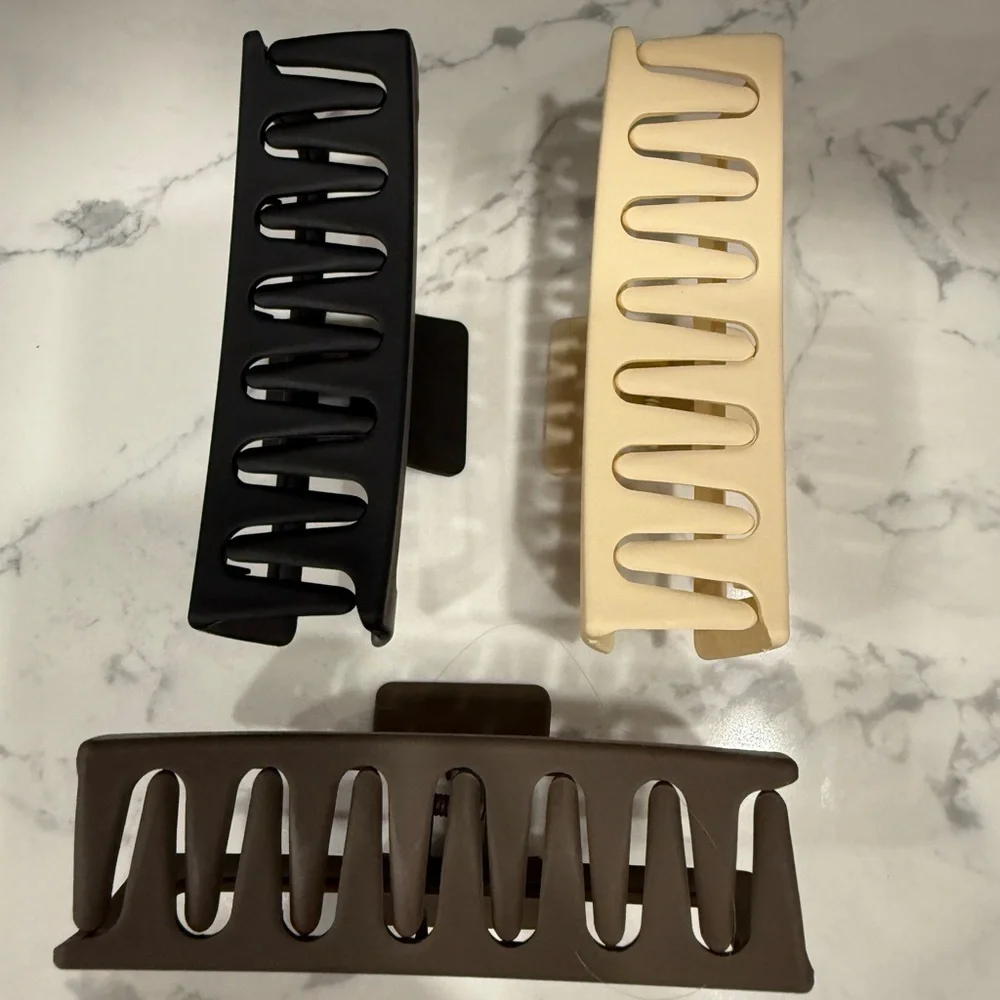 Three jumbo size claw hair clips tan black and brown